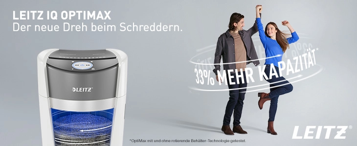 Das Bild zeigt den Aktenvernichter Leitz OptiMax mit der Beschreibung 'Der neue Dreh beim Schreddern' und einem Hinweis auf 33 % mehr Kapazität. Rechts im Bild stehen zwei Menschen, die Begeisterung über die verbesserte Leistung des Geräts ausdrücken.