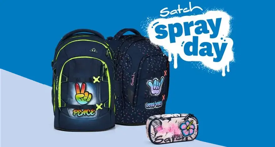 Zwei Rucksäcke von satch und ein Mäppchen wurden im Graffitistil besprüht. Darüber steht "spray day!"