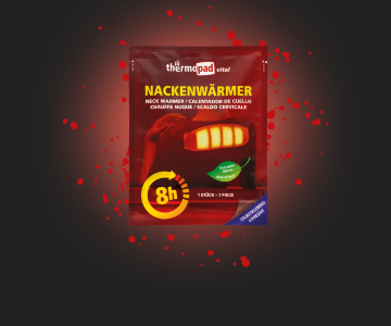 Nackenwärmerpad auf schwarzem Hintergrund mit roten Sprenkeln