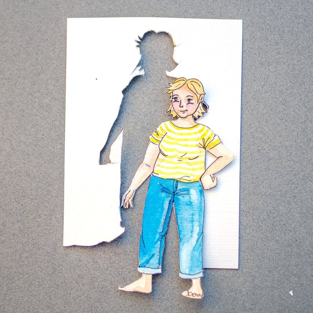 Mini-Me Figur einer Frau, aus Papier ausgeschnitten