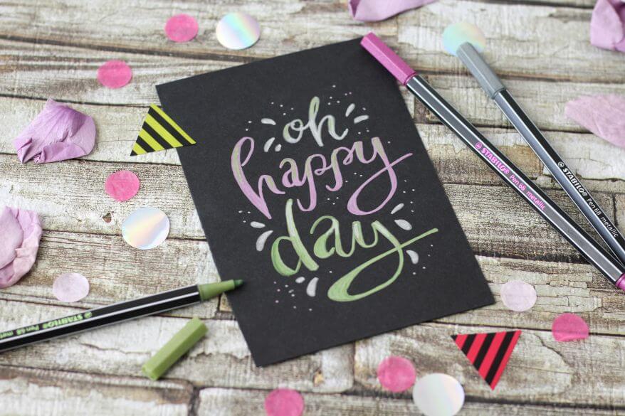 Eine schwarze Karte, belettert mit grünen und pinken Metallic Filzstift Pen 68 von Stabilo.