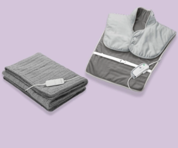 Heizkissen und -decke vor lila Hintergrund.