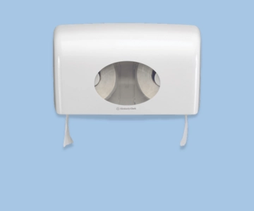 Toilettenpapierspender vor blauem Hintergrund.