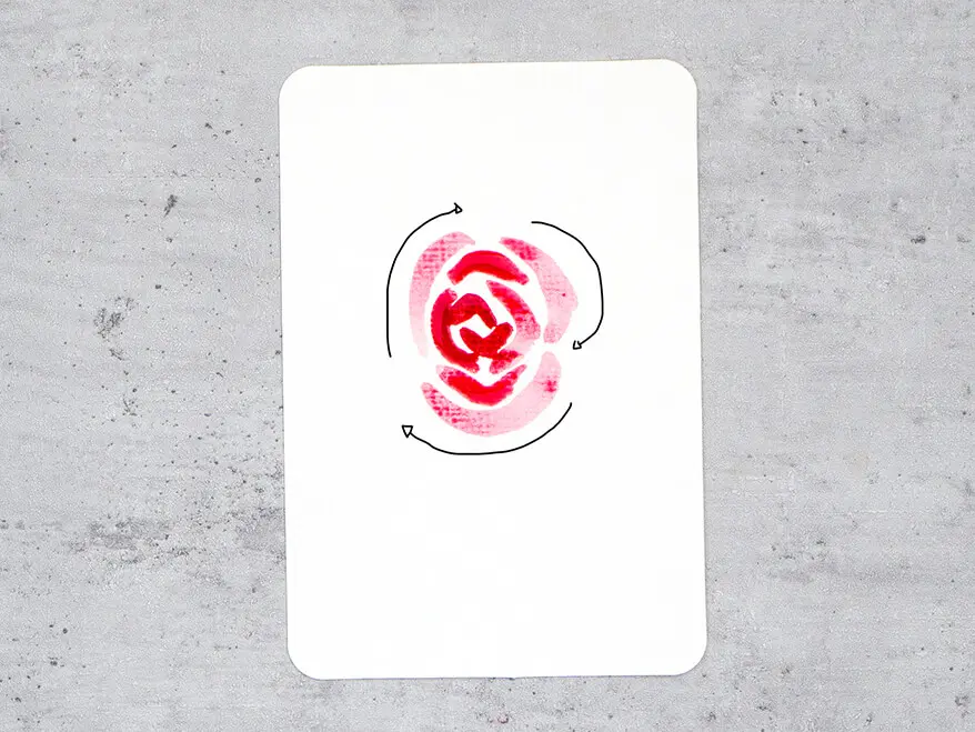 Auf eine Aquarellpostkarte von Hahnemühle wird Schritt für Schritt eine rote Rose aquarelliert. Hier ist Schritt vier zu sehen: vierte Schicht Blütenblätter.