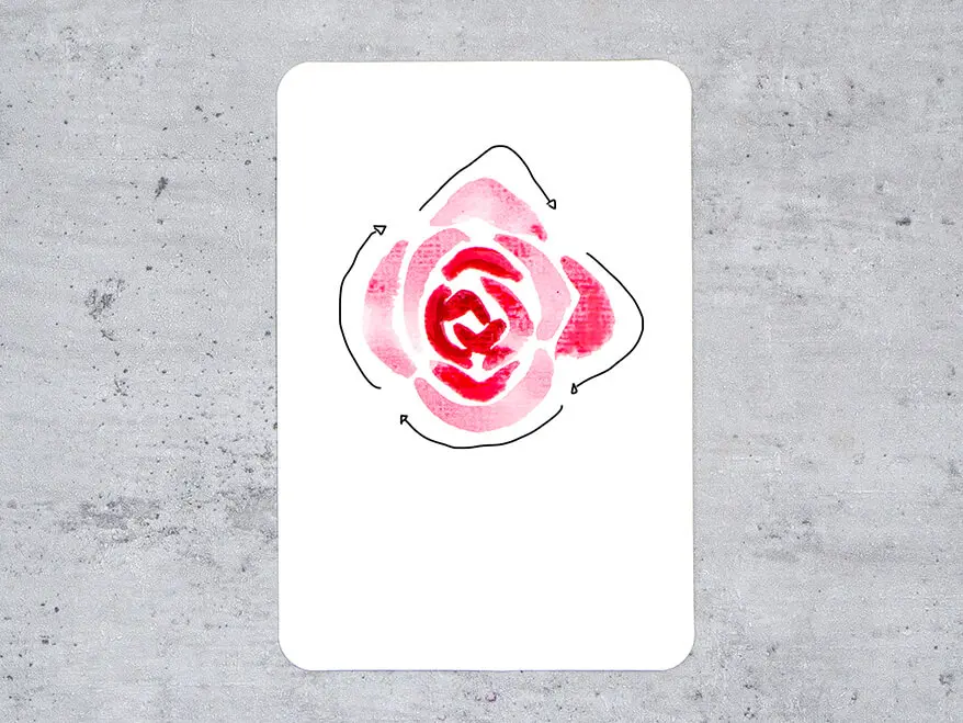 Auf eine Aquarellpostkarte von Hahnemühle wird Schritt für Schritt eine rote Rose aquarelliert. Hier ist Schritt fünf zu sehen: fünfte Schicht Blütenblätter.