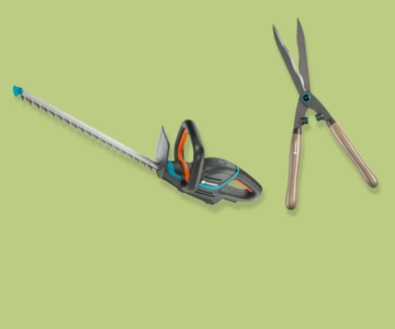 Heckenschere vor grünem Hintergrund.