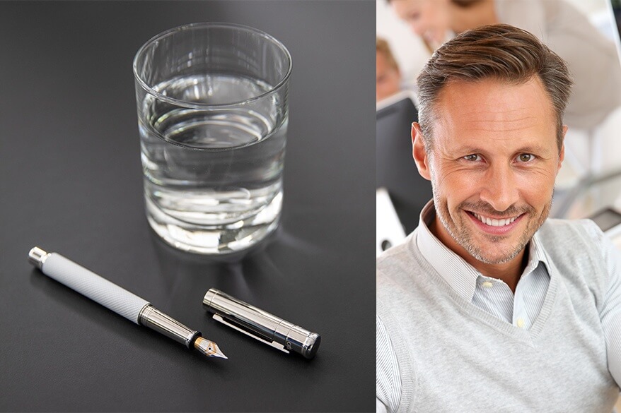 Auf der linken Seite liegt ein Füllhalter design04 von Otto Hutt auf einem Tisch, daneben steht ein Glas Wasser. Auf der rechten Seite schaut ein Mann in die Kamera.