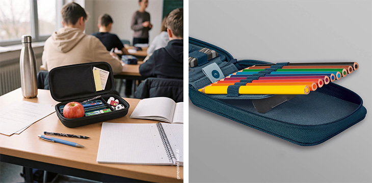 Geöffnetes Federmäppchen s‘maepp von Brunnen mit Stiften und Schulmaterial auf einem Tisch im Klassenraum.