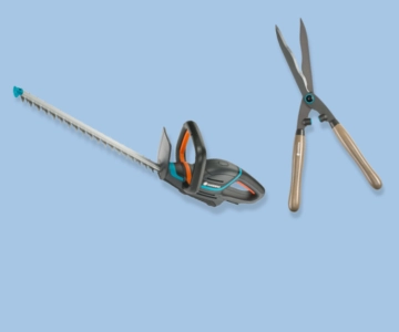 Heckenscheren vor blauem Hintergrund.