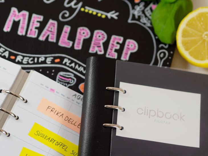 Zwei offene Planer mit Wochenplan und Clipbook von Filofax