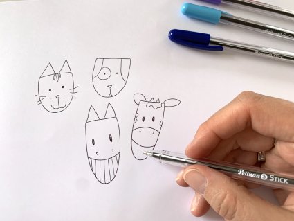 Jemand zeichnet aus einfachen Formen Tierköpfe als Illustrationen mit einem Pelikan-Kugelschreiber.