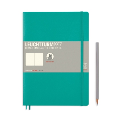 Ein Composition Notizbuch Blanko in türkis. Rechts daneben liegt ein silberner Bleistift.